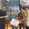 Mr. Mohd Fadhli Zil Ikhram receiving his ILSSI Lean Six Sigma Green Belt certificate at the MBizM Gathering Ceremony
